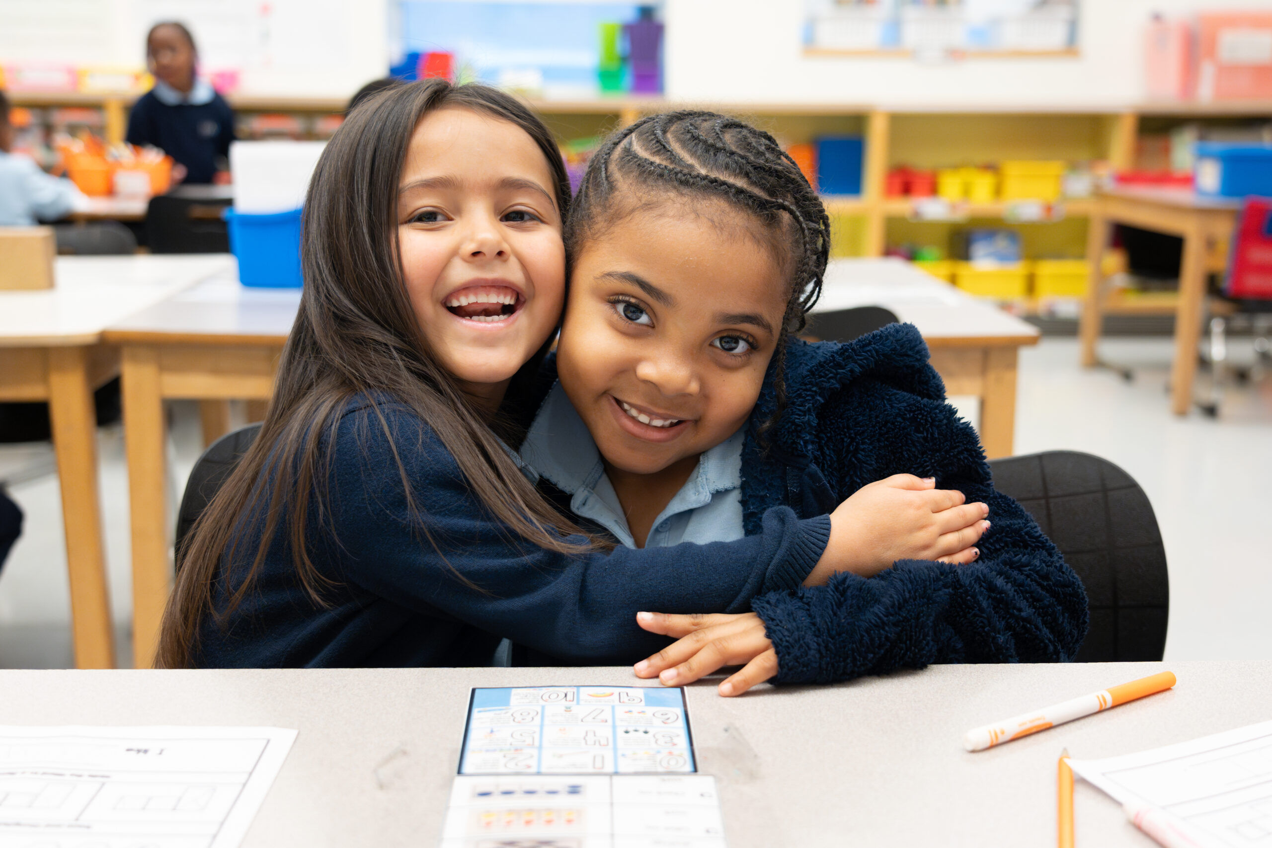 ES_K_students_hugging_smiling ES_K_students_hugging_smiling